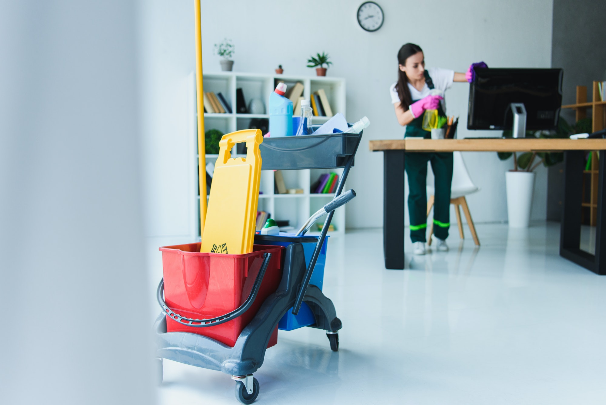 young-female-janitor-cleaning-office-with-various-cleaning-equipment.jpg young-female-janitor-cleaning-office-with-various-cleaning-equipment.jpg